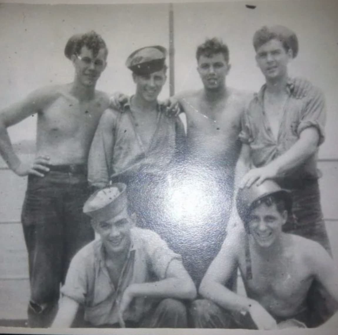 “My Dad 1940s (Lower Right with the Helmet On).” 
